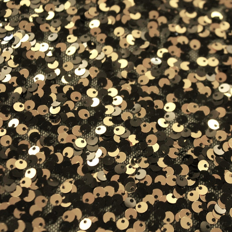 A flat sample of ragtime stretch mesh sequin in the color black-gold.