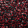 A flat sample of ragtime stretch mesh sequin in the color black-red.