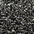 A flat sample of ragtime stretch mesh sequin in the color black-silver.