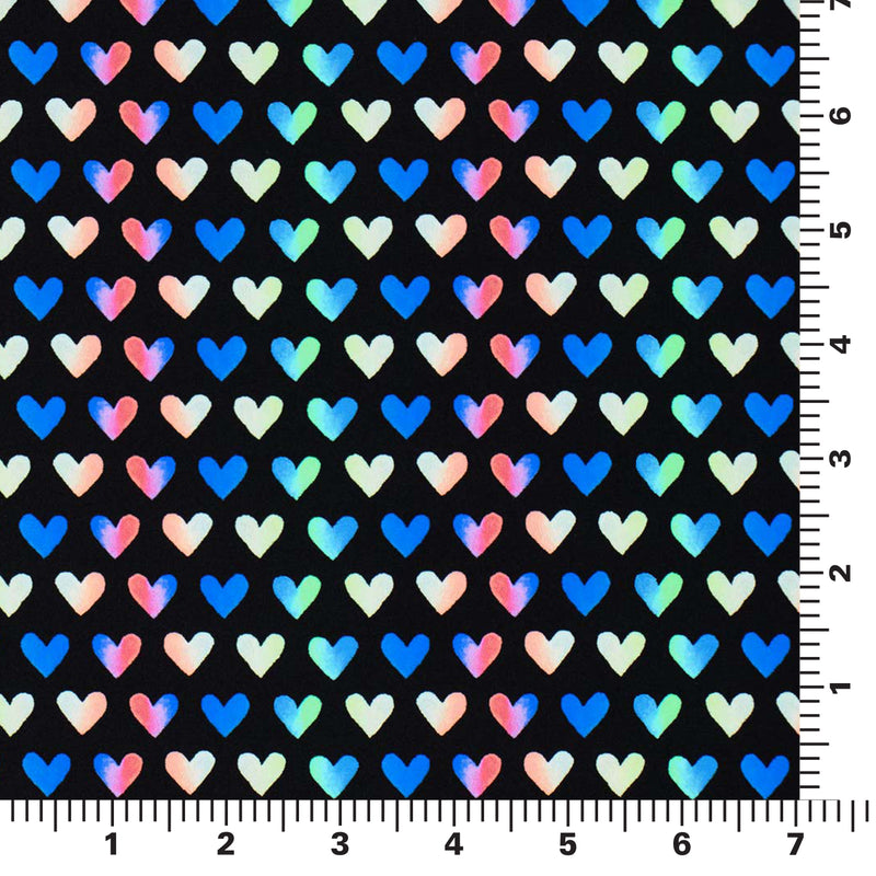 Flat piece of Rainbow Hearts Printed Spandex on a 7" by 7" ruler..