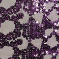 A flat sample of rabel stretch mesh sequin in the color black with purple sequin.