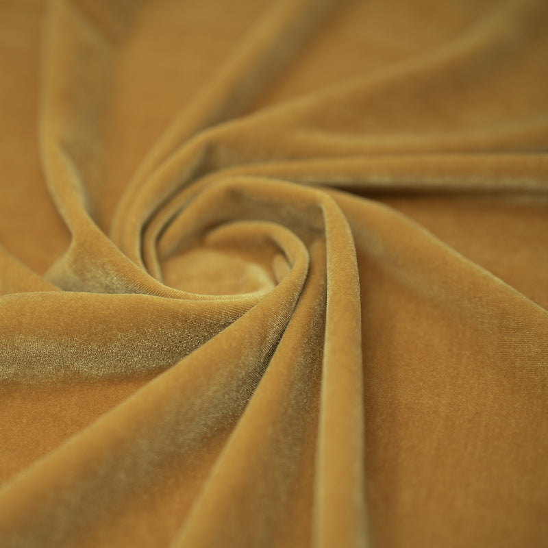 A swirled sample of regal matte stretch velvet in the color Nude
