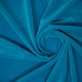 A swirled sample of regal matte stretch velvet in the color Turquoise