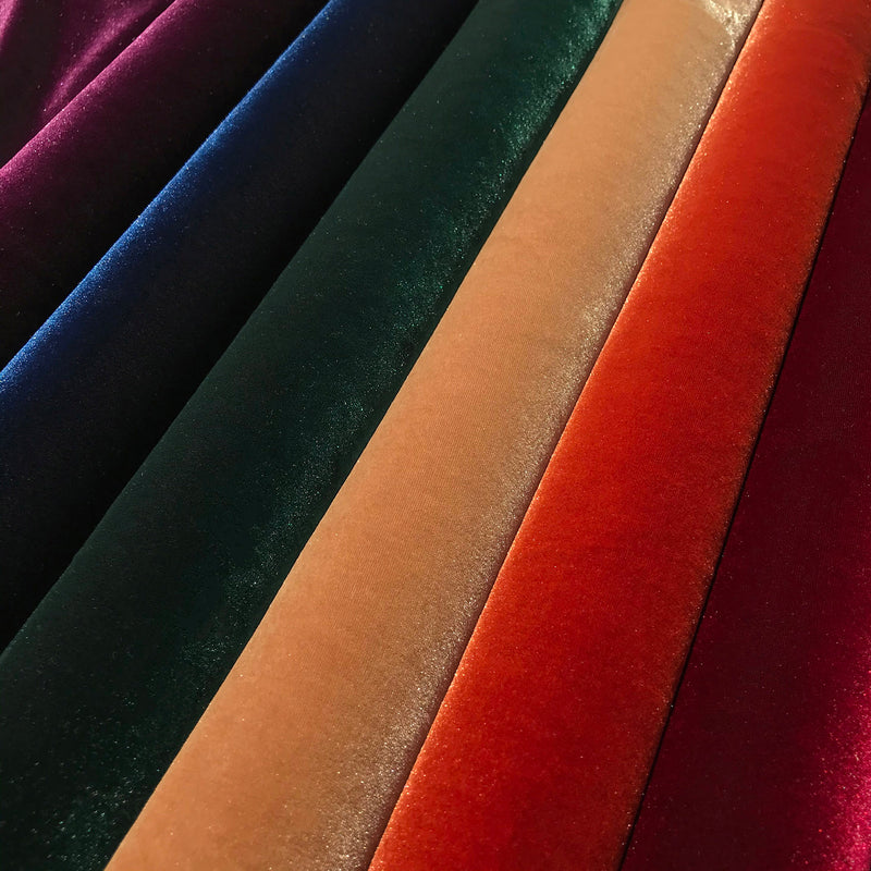 A folded sample of regal mate stretch velvet in all available colors.