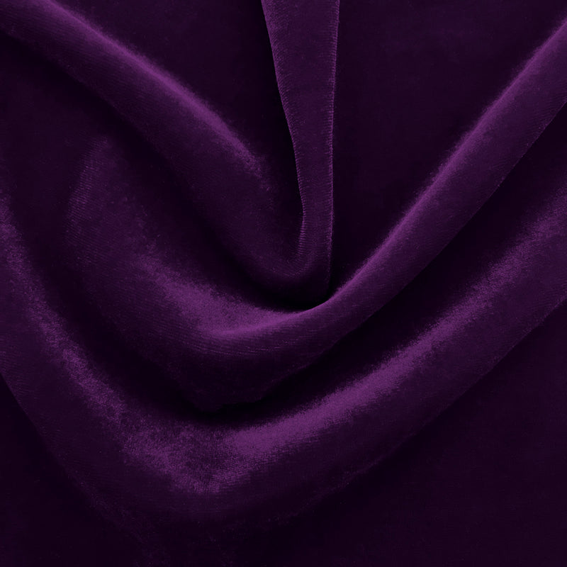 A swirled sample of regal matte stretch velvet in the color jewel purple.