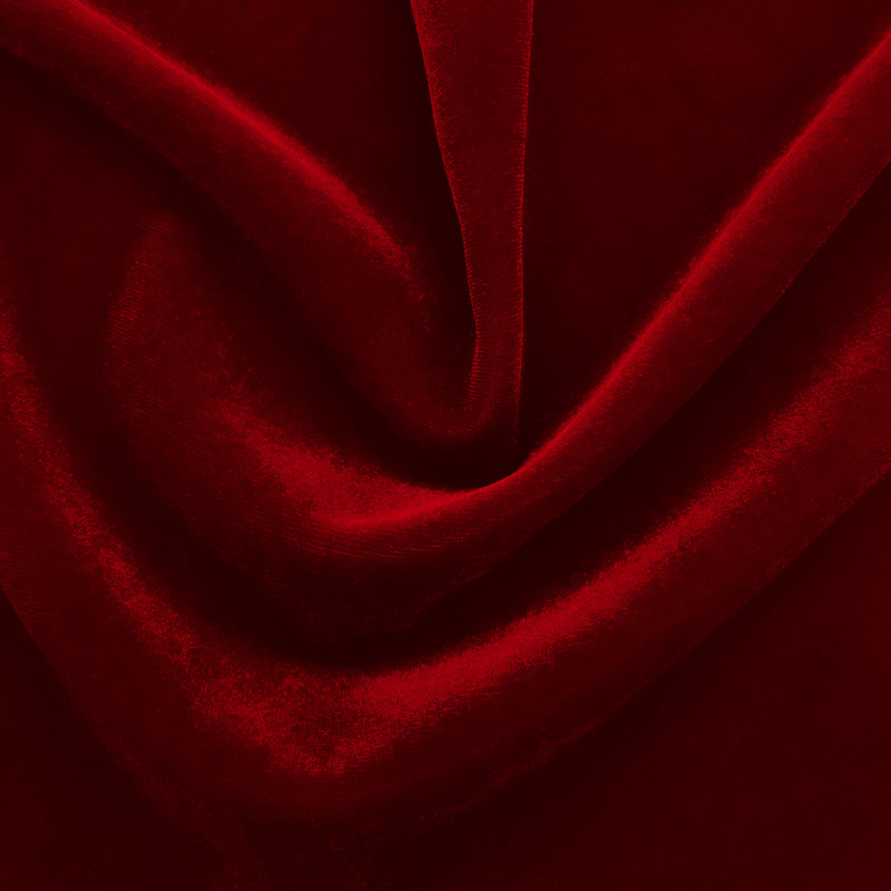 A swirled sample of regal matte stretch velvet in the color red.
