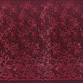A panel of Renaissance, an embroidered design of leaves and vines with burgundy sequin on a burgundy stretch mesh base.