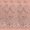 A panel of Renaissance, an embroidered design of leaves and vines with coral sequin on a coral stretch mesh base.