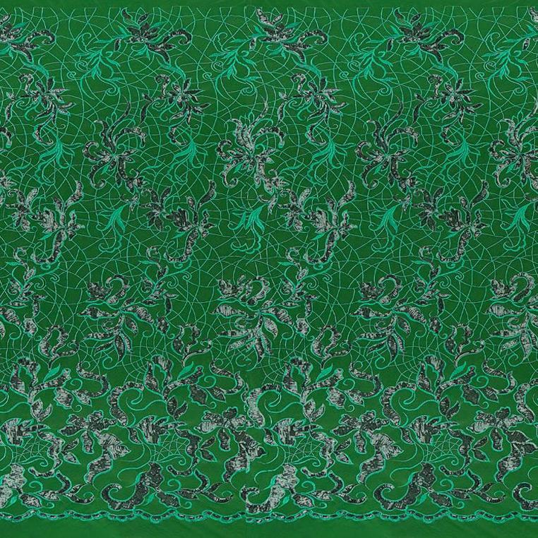 A panel of Renaissance, an embroidered design of leaves and vines with green sequin on a green stretch mesh base.