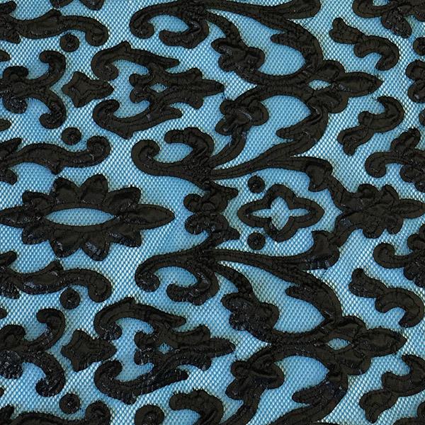 A flat sample of renee embroidered mesh in the color black-blue.