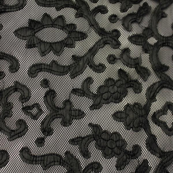 A flat sample of renee embroidered mesh in the color black.