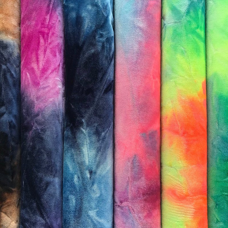 A folded sample of renegade tie-dyed stretch velvet in all available colors.