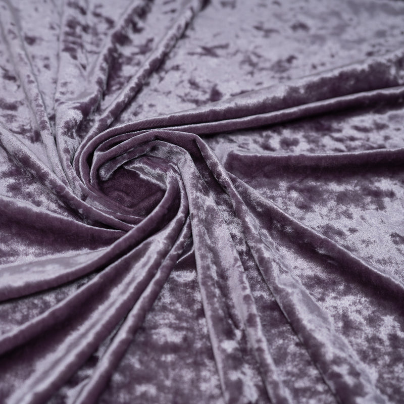 A swirled piece of Revival Crushed Stretch Velvet in the color Dusty-Orchid