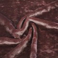 A swirled piece of Revival Crushed Stretch Velvet in the color Dusty-Pink