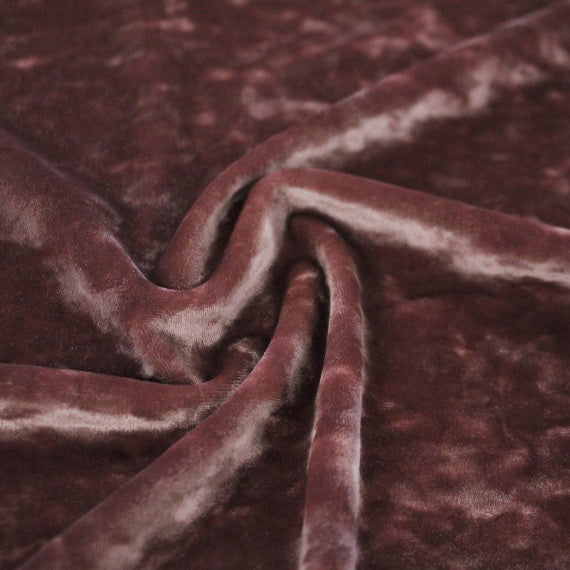 A swirled piece of Revival Crushed Stretch Velvet in the color Dusty-Pink