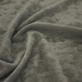 A swirled sample of revival crushed stretch velvet in the color silver.