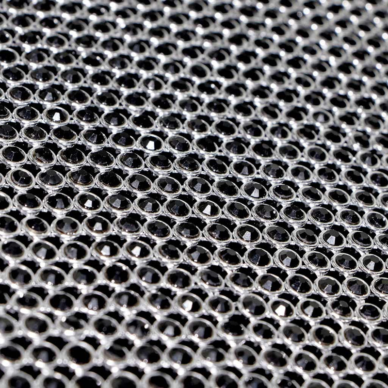 A flat sample of rhinestone aluminum scale mesh in the color black.
