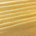 A flat sample of Ribbed Velvet Spandex Fabric in the color Butterscotch