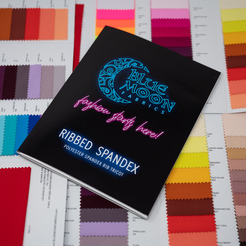 A sample of Ribbed Spandex Color Card with Expansion Card in Blue Moon Fabrics with all color options in the background