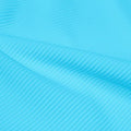 A rippled piece of Ribbed Spandex in the color cyan.