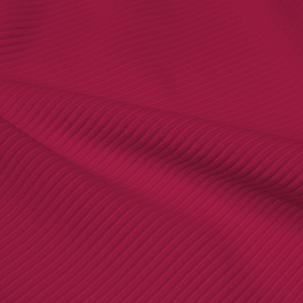 A rippled piece of Ribbed Spandex in the color dark magenta.