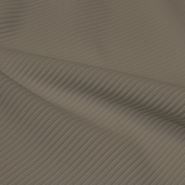 A rippled piece of Ribbed Spandex in the color dust.