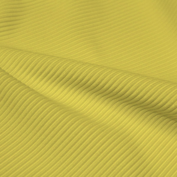 A rippled piece of Ribbed Spandex in the color low key lemon.