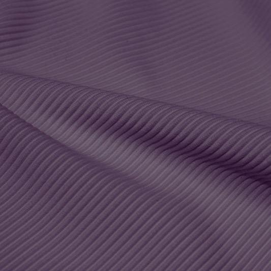 A rippled piece of Ribbed Spandex in the color purple haze.