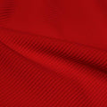 A rippled piece of Ribbed Spandex in the color red.