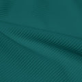 A rippled piece of Ribbed Spandex in the color teal green.