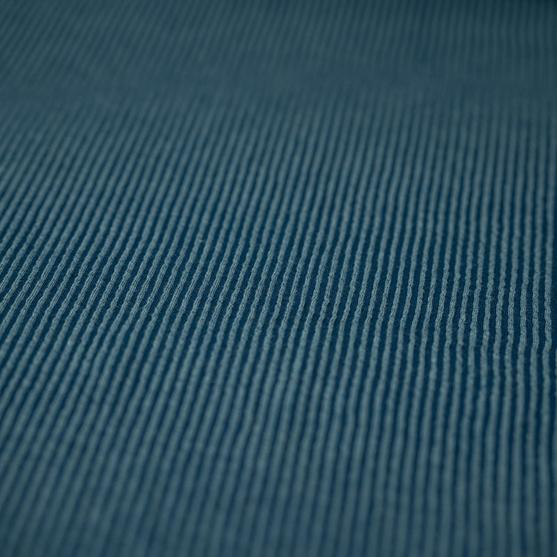 Detailed shot of Rib Knit in color Poseidon Blue.