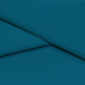A folded piece of Ripple Recycled Polyester Spandex in the color deep turquoise.