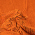 Detailed interior shot of Ritzy Crinkle Nylon Polyester Spandex with Metallic in the color Outrageous-Orange