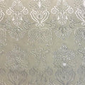 A flat sample of royalty embossed tretch velver in the color cream.