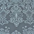 A flat sample of royalty embossed tretch velver in the color deep sea blue.
