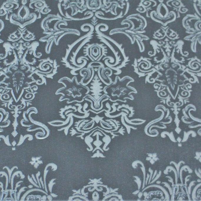 A flat sample of royalty embossed tretch velver in the color deep sea blue.
