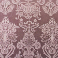 A flat sample of royalty embossed tretch velver in the color mauve.