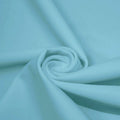 A swirled piece of microfiber nylon spandex in the color Blue Star