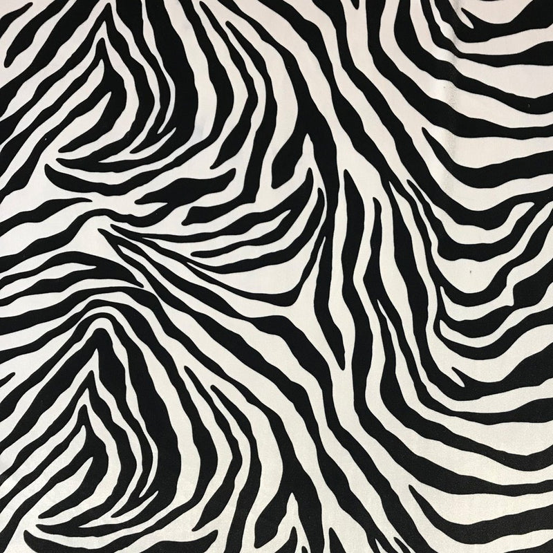 A flat sample of safari printed stretch velvet in the zebra print.
