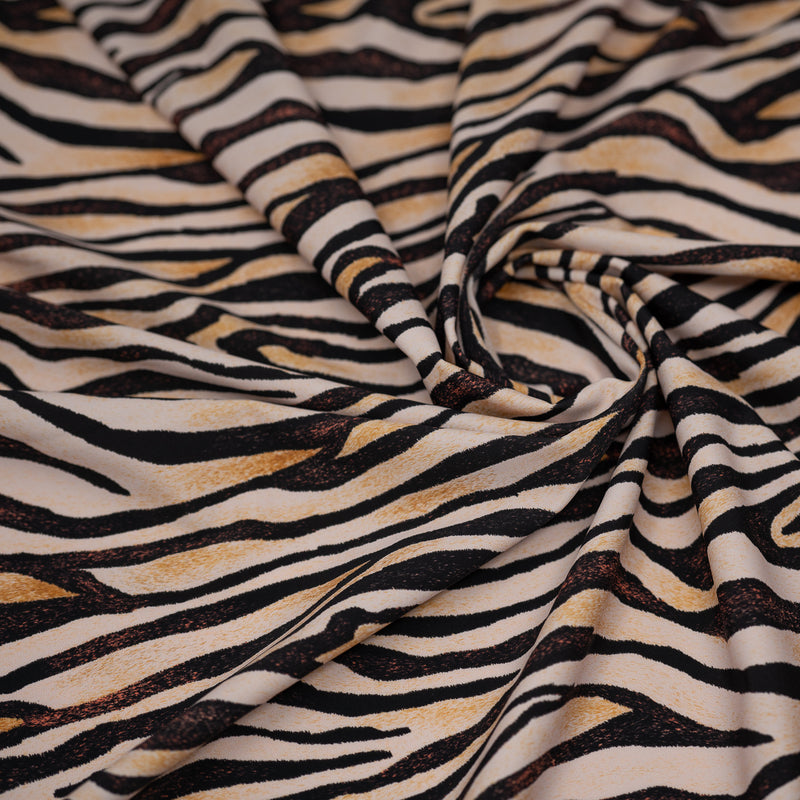 A swirled piece of Sandy Zebra Printed Spandex.