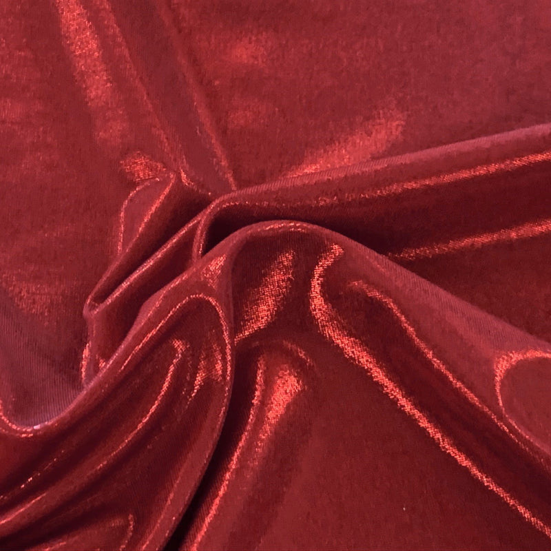 A swirled piece of sheen foiled spandex in the color red.