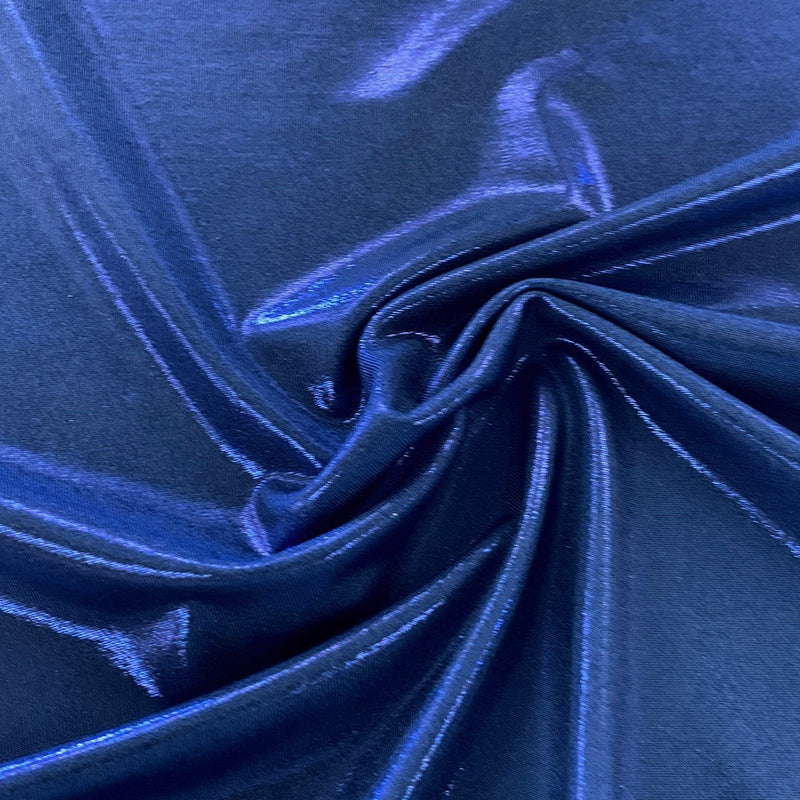 A swirled piece of sheen foiled spandex in the color royal.