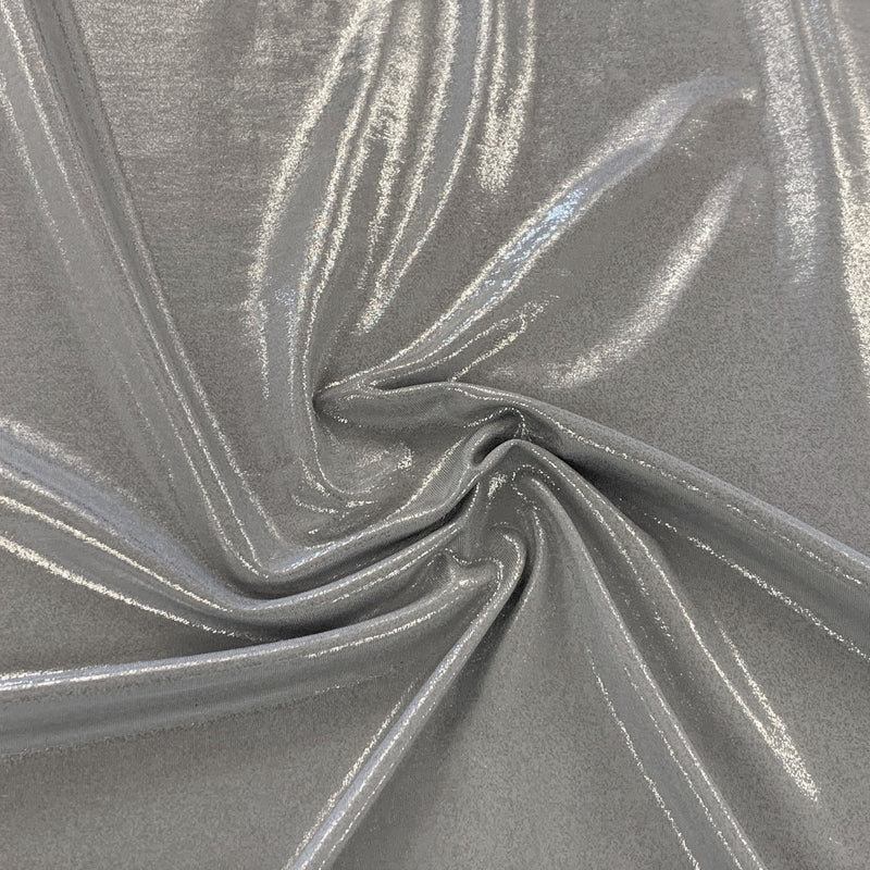 A swirled piece of sheen foiled spandex in the color silver.