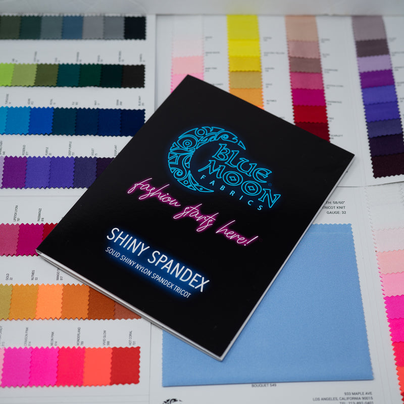 A sample of Shiny Nylon Spandex Color Card with Expansion Card with all color options in the background
