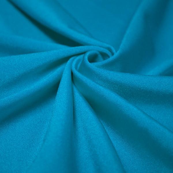 A swirled piece of shiny nylon spandex in the color azure.