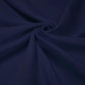 A swirled piece of shiny nylon spandex in the color blue navy.