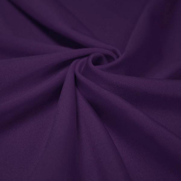 A swirled piece of shiny nylon spandex in the color eggplant.