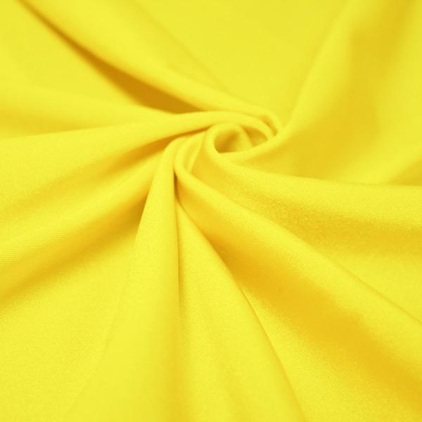 A swirled piece of shiny nylon spandex in the color electric yellow.