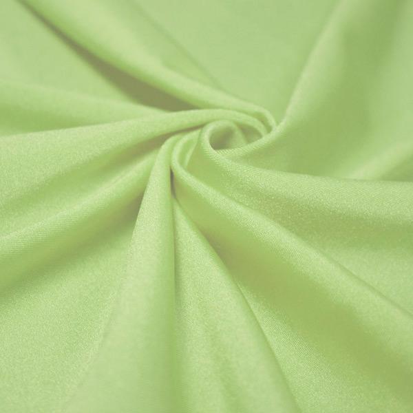 A swirled piece of shiny nylon spandex in the color lucky charm.
