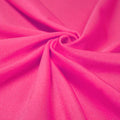 A swirled piece of shiny nylon spandex in the color neon pink.